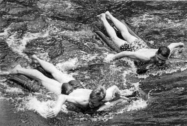Dennis von Maarenberg and Rex Filson racing on lilos. Lerderderg River, circa 1965.